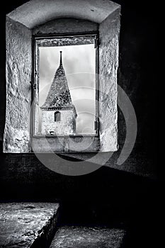 This image is taken from within one of the towers of the Castle of Gruyere or more properly ChÃ…Â teau de Gruyeres, looking out at